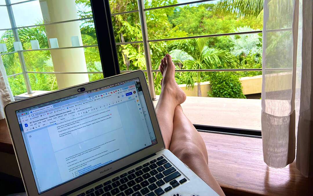 Digital nomad working in nature with MacBook Air laptop