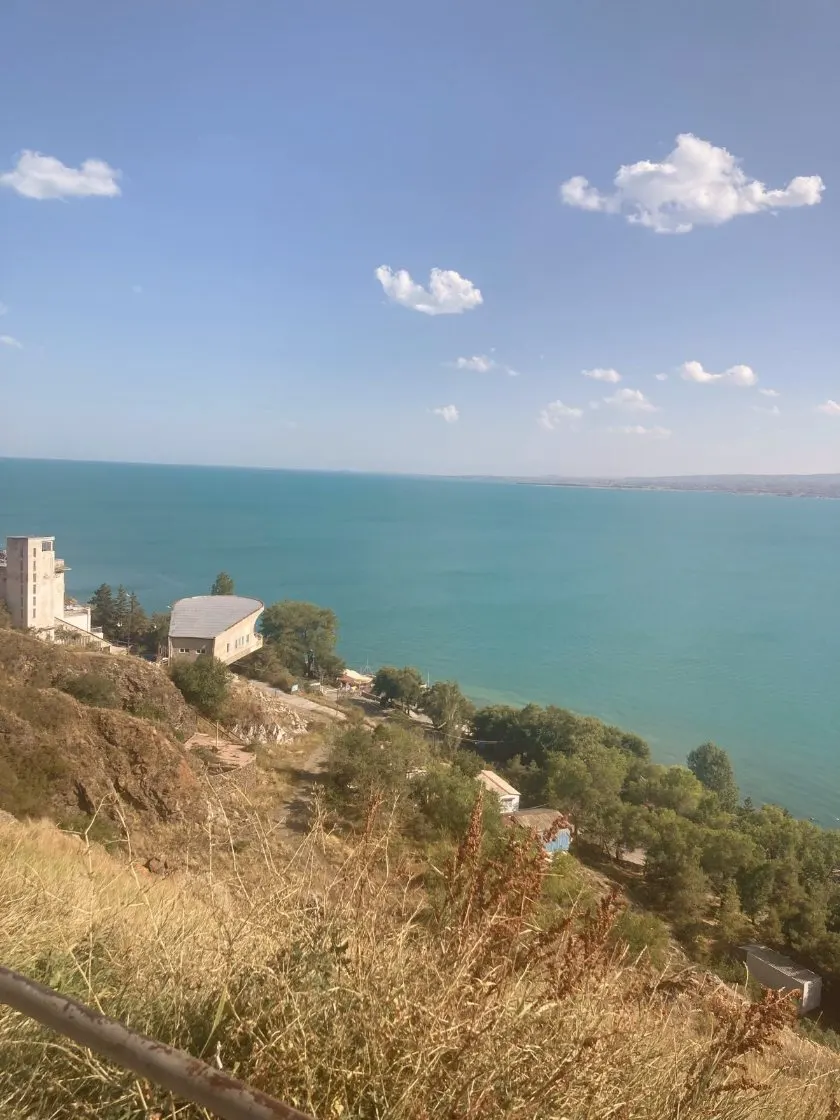 Turquoise Lake Sevan under a blue sky in Armenia