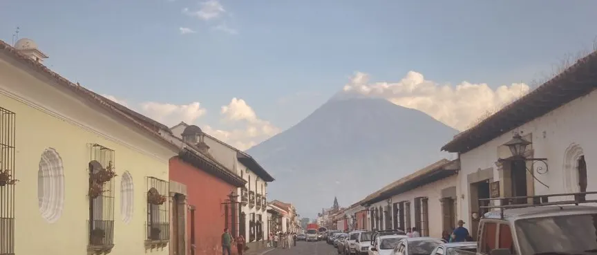Cobblestone street with a volcano beyond in Antigua, Guatemala